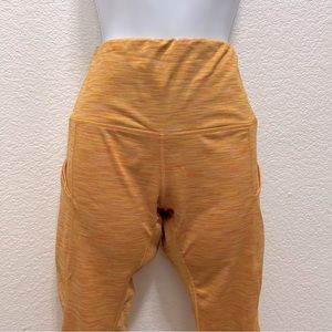 Yellow smooth legging with side pockets for phone, fits 5’4” range, gently used